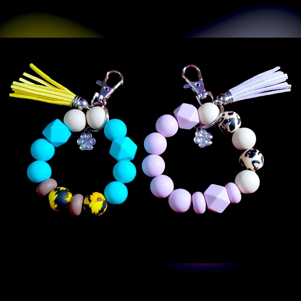 Keychain Wristlets made by MyGirls. Both with Paw Print Charms & Tassels